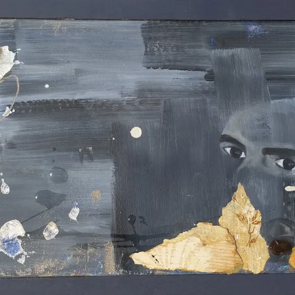 A painting of a man 's face and some debris.